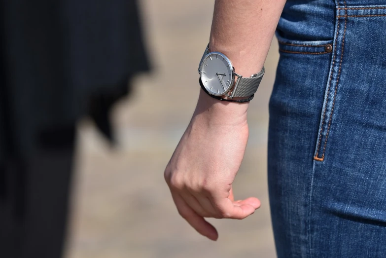 a close up of a person wearing a wrist watch, by Raphaël Collin, walk, dressed in a gray, student, pathetic