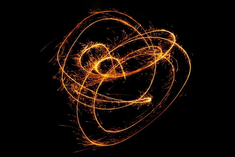 a sparkler in the shape of a heart on a black background, digital art, long exposure photo, golden spirals, orange halo, some chaotic sparkles