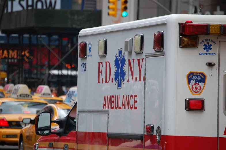 a close up of an ambulance on a city street, by Sam Dillemans, ny, 6 4 0, body shot, broadway