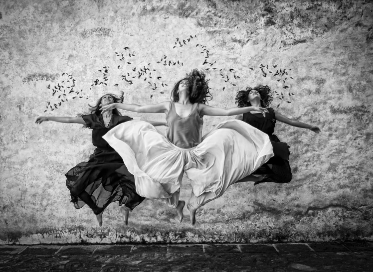 a couple of women that are jumping in the air, by Fede Galizia, art photography, the three fates, breathtaking composition, greg ruth, portrait image