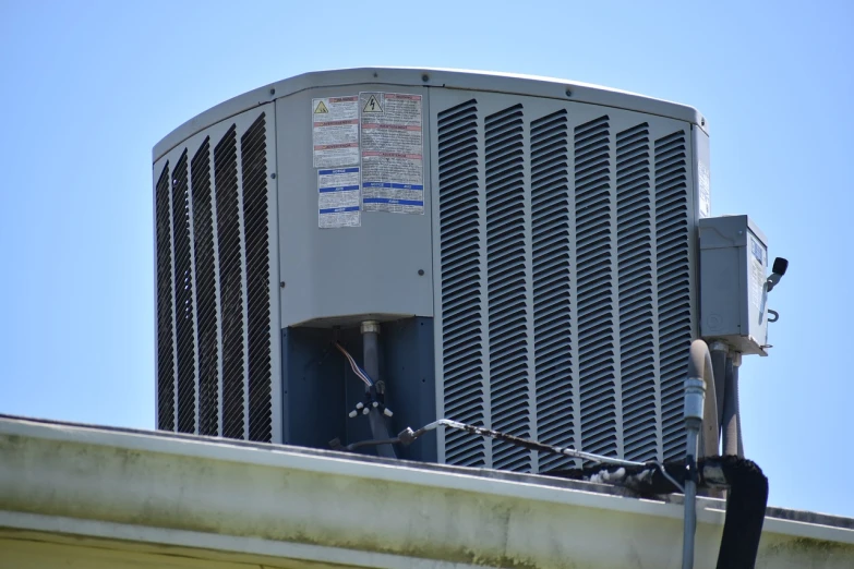 a large air conditioner sitting on top of a building, by Matt Stewart, flickr, renaissance, florida, fake hidden detail, mid closeup, rooftop