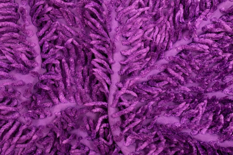 a close up of a pile of purple yarn, a macro photograph, inspired by Lynda Benglis, biomechanical corals, fractal leaves, 8k fabric texture details, highly detailed product photo