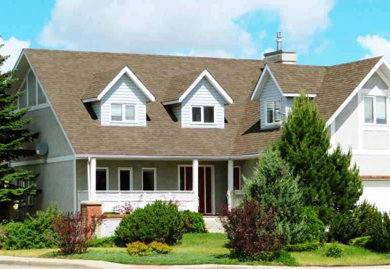 a house with a car parked in front of it, by Pamela Drew, shutterstock, turf roof, peaceful suburban scene, brown, yeg