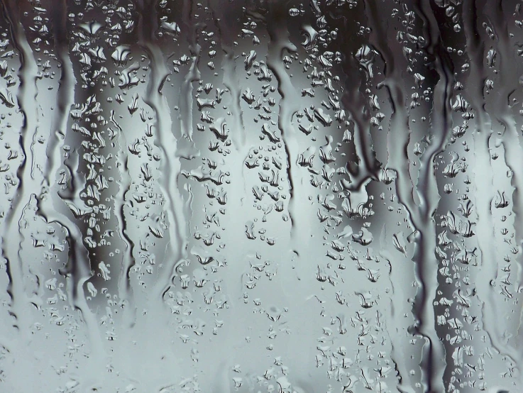 a close up of water droplets on a window, a microscopic photo, minimalism, dripping black and grey paint, wallpaper - 1 0 2 4, clear glass wall, rivulets