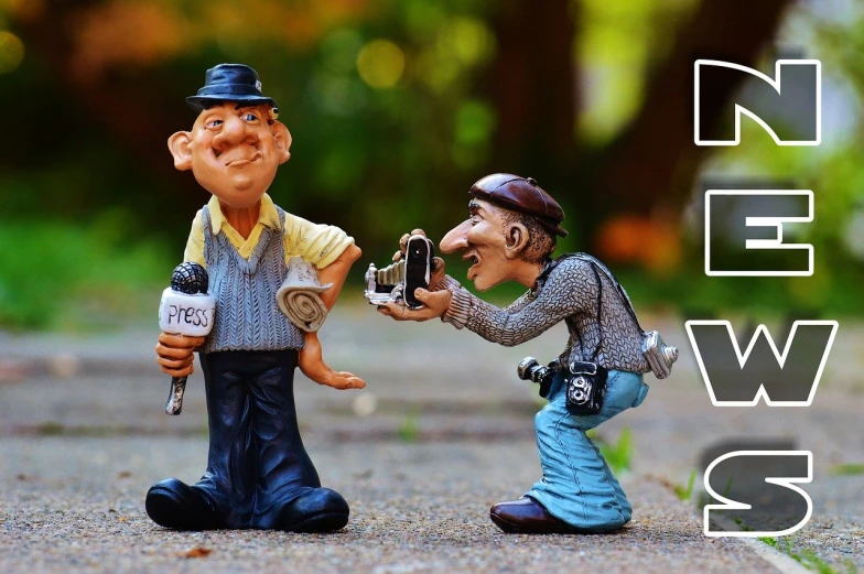 a couple of figurines sitting next to each other, a picture, pixabay contest winner, figurativism, pointing at the camera, dlsr camera, header text”, pixv