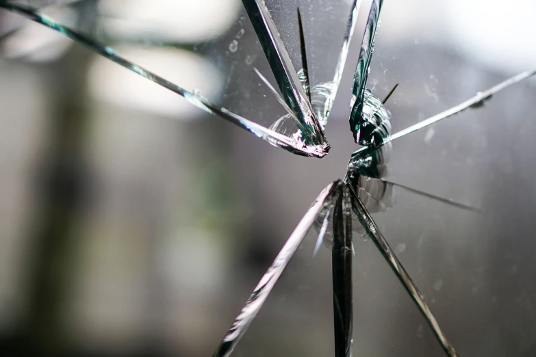 a close up of a broken glass window, pexels, istockphoto, glass arms, difraction from back light, transparent black windshield