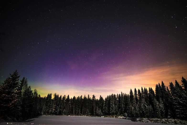 a sky filled with lots of purple and green lights, by Jacob Kainen, finland, outside winter landscape, purple orange colors, star lit sky