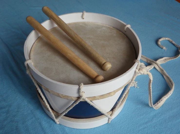 a close up of a drum with two drums in it, inspired by Masamitsu Ōta, flickr, full lenght view. white plastic, traditional corsican, homemade, navy