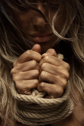 a close up of a person holding a rope, a picture, hands shielding face, blonde women, depressed, ad image