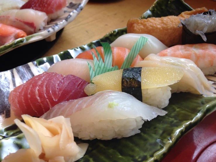 a close up of a plate of sushi on a table, a picture, by Maki Haku, a brightly colored, japan shonan enoshima, blog-photo, seen from below