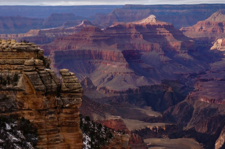 a group of people standing on top of a cliff, by Linda Sutton, pexels, grand canyon, hyper - detailed color photo, photograph credit: ap, snowy canyon at dawn