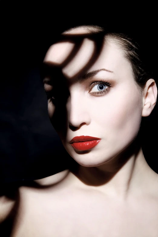 a close up of a woman with red lipstick, a portrait, inspired by George Hurrell, flickr, bauhaus, istockphoto, perfect shadow, ivan shiskin, mid-shot portrait of a beautiful