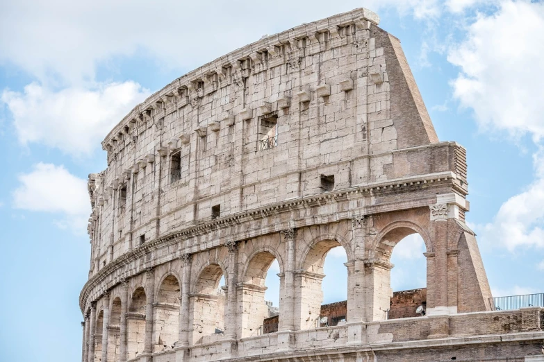 a clock that is on the side of a building, by Pogus Caesar, pexels, neoclassicism, in the colosseum, huge support buttresses, holes in the lower jaw, rounded roof