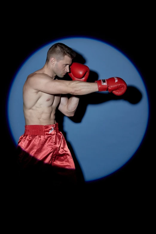 a shirtless man wearing red boxing gloves, a photo, inspired by Svetlin Velinov, full length photo, red and blue lighting, professional portrait photo, christian cline