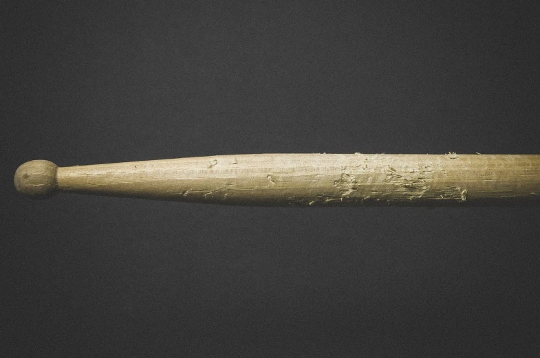 a close up of a baseball bat on a black background, inspired by Muirhead Bone, artefact, above side view, hard clay, 4 0 0 mm