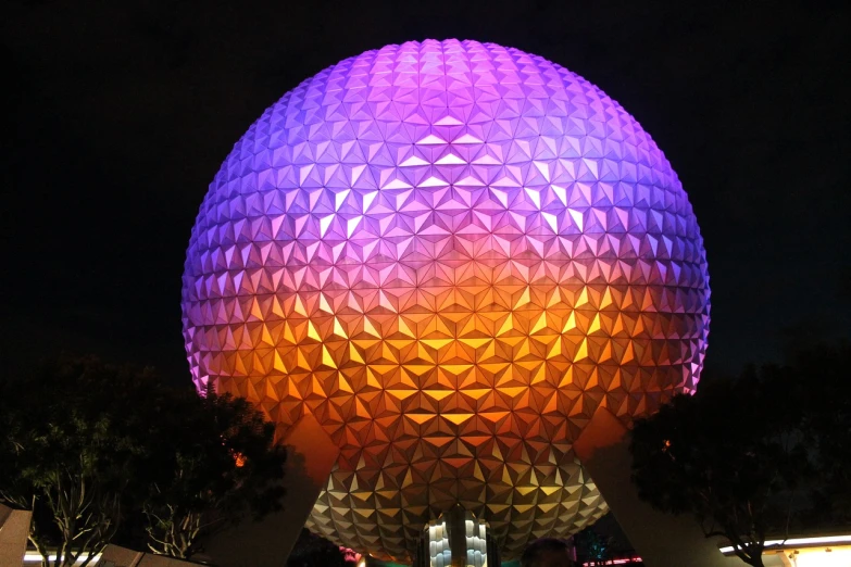 a large sphere shaped building lit up at night, a photo, flickr, epcot, hyperdetailed colourful, ripley scott, stunning gradient colors