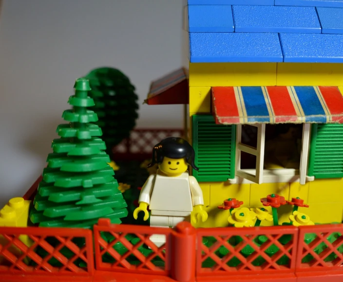 a lego house sitting on top of a table, by Brenda Chamberlain, flickr, in the garden, portait image, random detail, window open