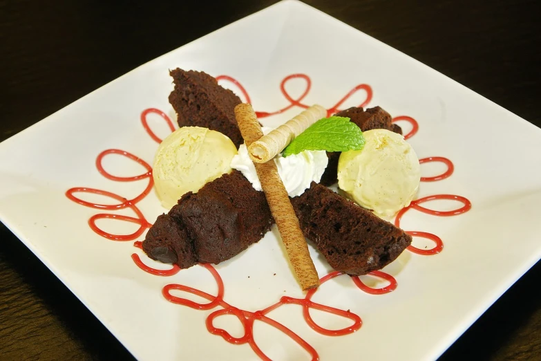 a white plate topped with a piece of cake and ice cream, renaissance, fuji choco, stick, photo, mid shot photo