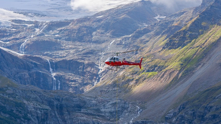 a helicopter that is flying over a mountain, by Dietmar Damerau, maintenance photo, fjords, scene!!, hi resolution