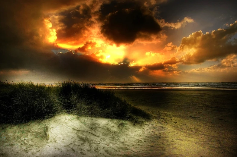 a lone surfboard sitting on top of a sandy beach, inspired by Andreas Achenbach, flickr, romanticism, burning clouds, ! apocalypse landscape!!, sand dunes, bathed in the the glow of a fire