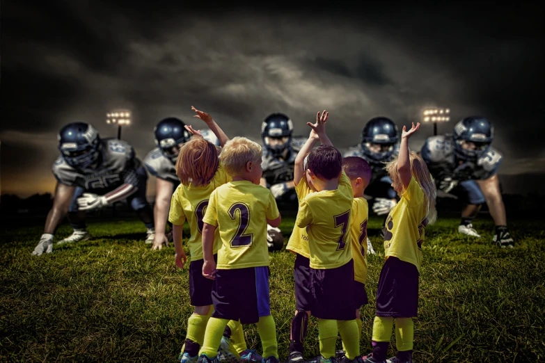 a group of young boys standing on top of a lush green field, a colorized photo, by Wayne England, shutterstock, realism, football armor, ravens stormy sky of foreboding, hands up, high quality fantasy stock photo