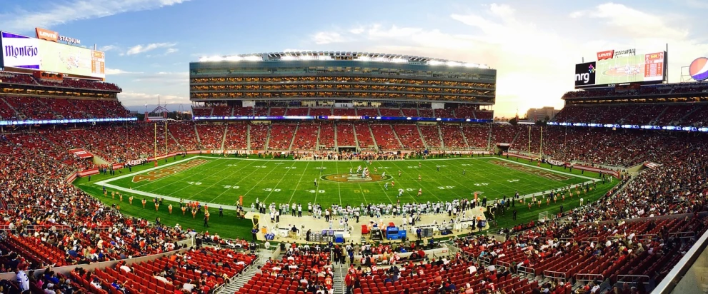 a football stadium filled with lots of people, by Douglas Shuler, cupertino, panoramic shot, beautifully lit, san francisco