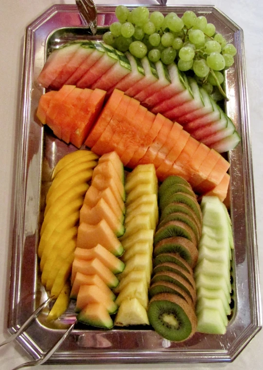 a tray filled with lots of different types of fruit, by Susan Heidi, hurufiyya, sushi, crisp smooth lines, silver, thai