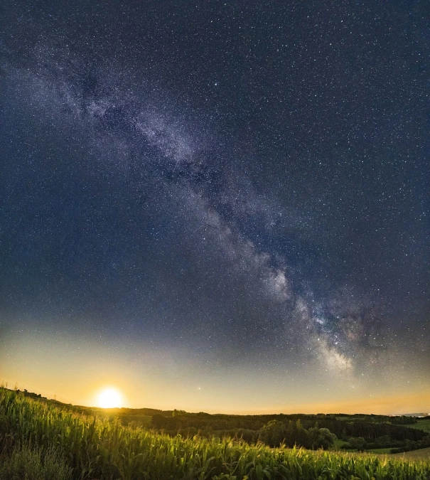 the milky shines brightly in the sky above a corn field, renaissance, milky way, looking off into the sunset, sweeping vista, suns and supernovas