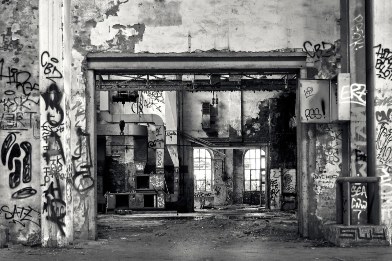 a black and white photo of a building with graffiti all over it, inspired by Thomas Struth, flickr contest winner, post apocalyptic room interior, detailed factory, in a old house. hyper realistic, view from the back