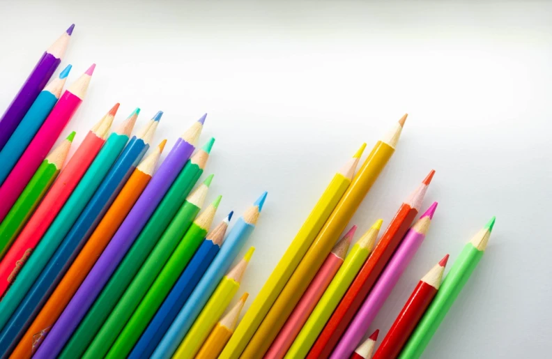 a group of colored pencils sitting next to each other, a color pencil sketch, full view blank background, on white paper, bright uniform background, bright vivid lighting