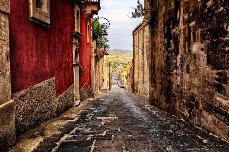 a narrow cobblestone street in an old town, a picture, by Domenico Induno, pexels contest winner, renaissance, vulcano, vibrant but dreary red, landscape vista, tlaquepaque