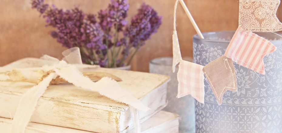 a bunch of books sitting on top of a table, folk art, lavender blush, banners, tattered, closeup photo