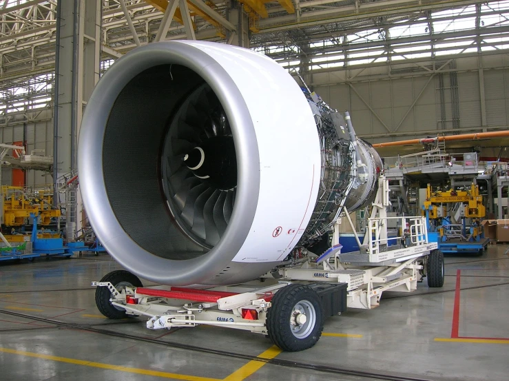 a large jet engine sitting inside of a hangar, a picture, flickr, large tail, hyper realistic ”, inspect in inventory image, sao paulo