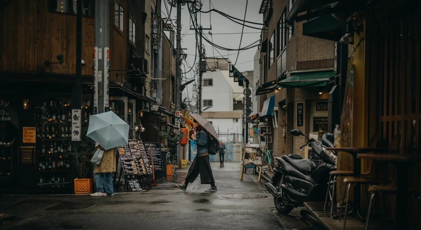 a person walking down a street with an umbrella, a picture, by Niko Henrichon, unsplash contest winner, ukiyo-e, 🕹️ 😎 🔫 🤖 🚬, gritty world, down-town, raining outside the cafe