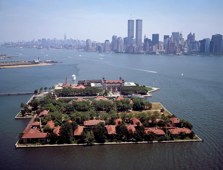 an island in the middle of a body of water, a tilt shift photo, by Stan Galli, on liberty island, photograph credit: ap, huge mansion, high light on the left