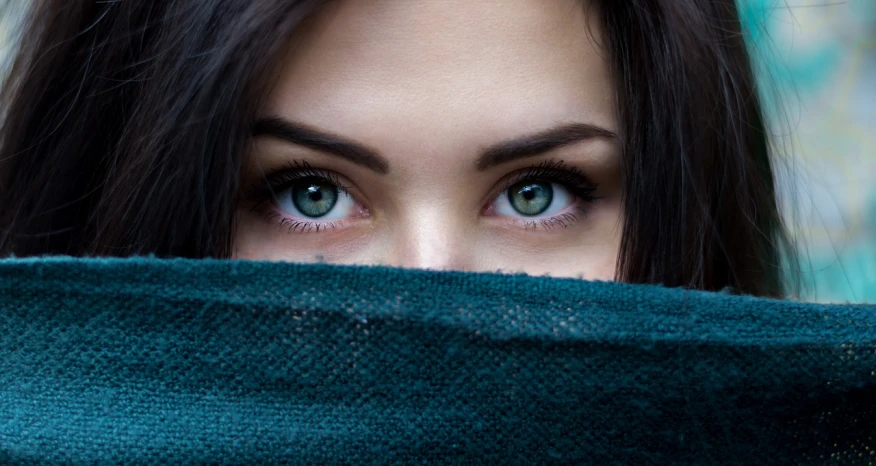 a close up of a woman's face behind a blanket, by Adam Marczyński, trending on pixabay, jade colored eyes, eyes). full body, looking up at camera, attractive girl