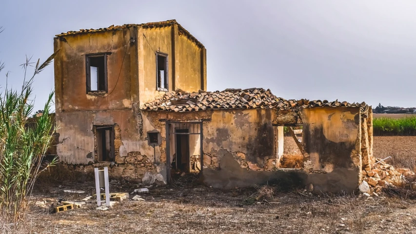 an old building sitting in the middle of a field, a portrait, by Antonín Chittussi, shutterstock, destroying houses, costa blanca, front side, italy