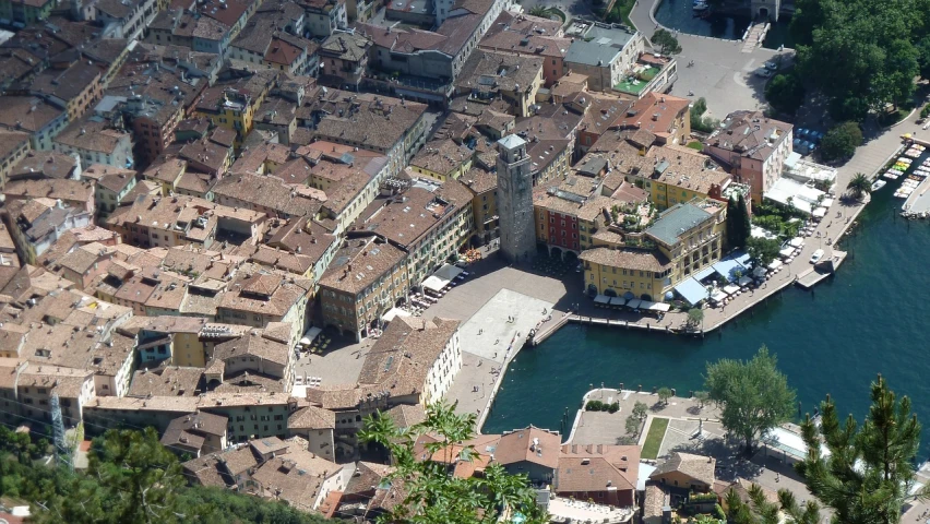 an aerial view of a city next to a body of water, by Carlo Martini, town square, tourist photo, few details, bizzaro