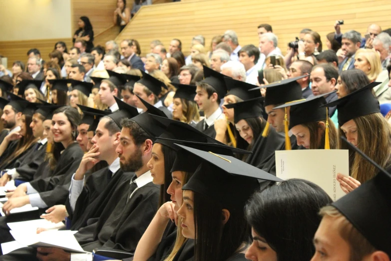 a large group of people wearing caps and gowns, a picture, by Juan O'Gorman, confortable atmosphere, meni chatzipanagiotou, not cropped, academicism