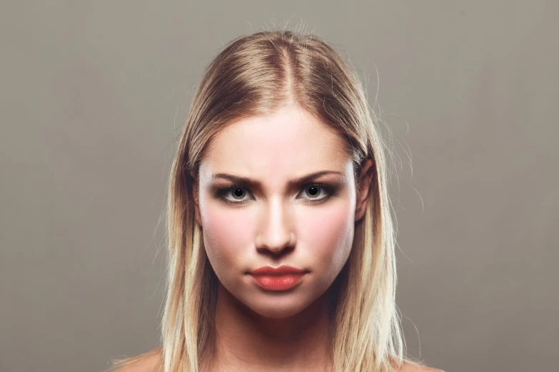 a woman with long blonde hair posing for a picture, by Kurt Roesch, shutterstock, face symmetry, young angry woman, defined cheekbones, small upturned nose