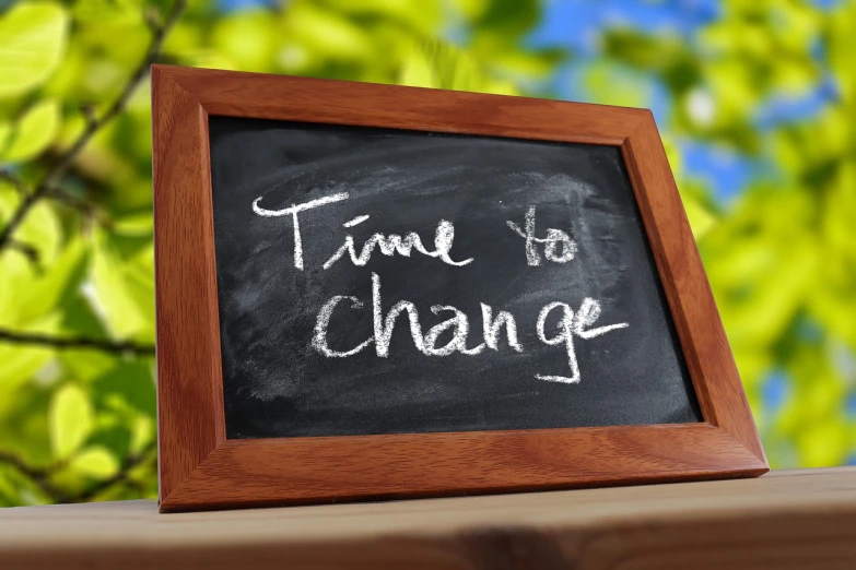 a chalkboard with the words time to change written on it, a picture, portlet photo, high res photo