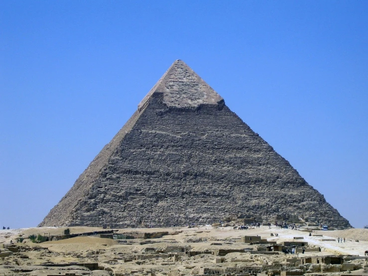 a very tall pyramid sitting in the middle of a desert, egyptian art, extremely clear and coherent, on a sunny day, from wikipedia, chiseled architecture