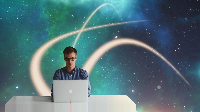 a man sitting in front of a laptop computer, by Kurt Roesch, pexels, space art, stylized background, high quality screenshot, avatar image, professional composition
