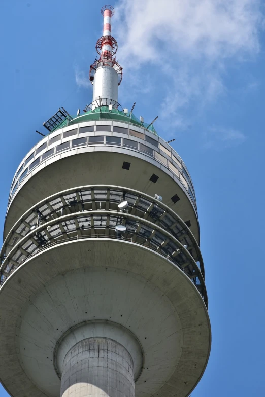 a tall tower with a clock on top of it, by Werner Gutzeit, shutterstock, plein air, view from bottom to top, transmitters on roof, munich, observation deck