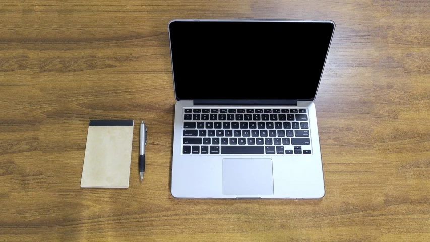 a laptop computer sitting on top of a wooden table, minimalism, pen, iphone photo, half body photo