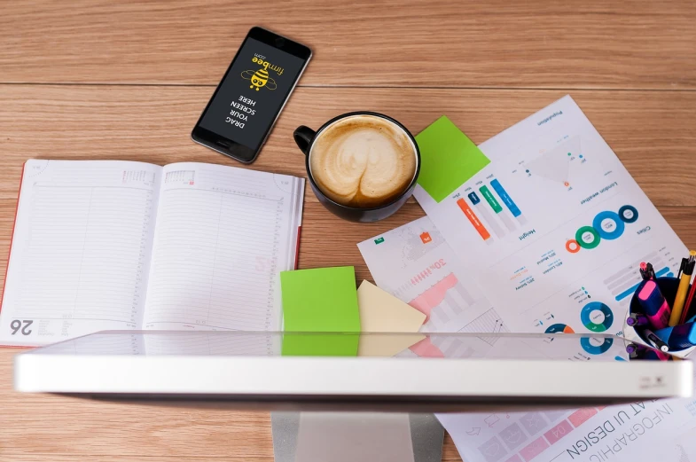 a laptop computer sitting on top of a wooden desk, a picture, analytical art, scanning items with smartphone, miniature product photo