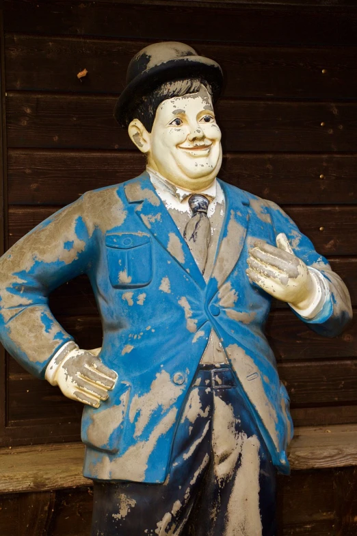 a statue of a man in a suit and tie, a statue, inspired by Otto Pilny, folk art, blue body, very very well detailed image, fat figure, dull flaking paint