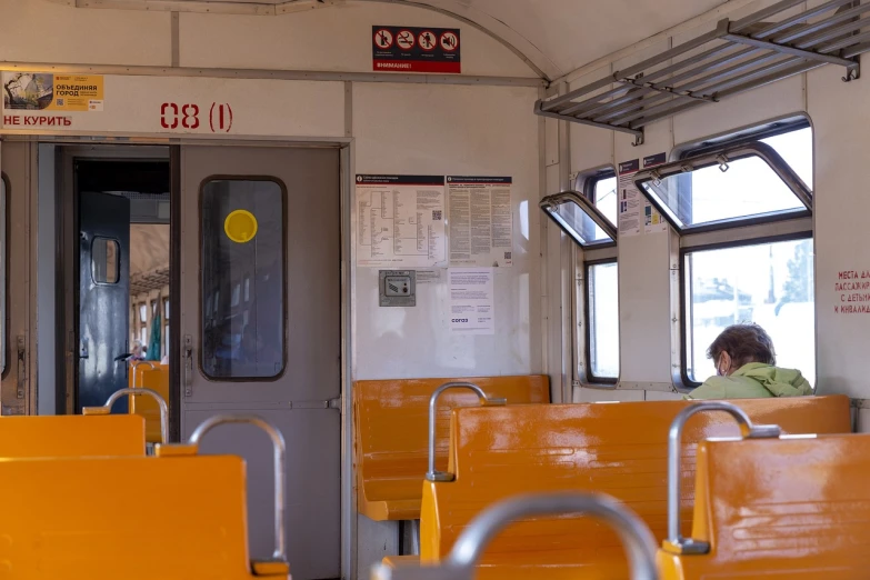 a woman sitting in a train looking out the window, mingei, interior of staten island ferry, 8k octan photo, service ticket close up, 2 0 2 2 photo