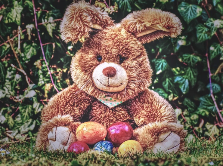 a teddy bear that is sitting in the grass, a colorized photo, by Joe Bowler, photorealism, holding easter eggs, photo taken in 2 0 2 0, highly detailed picture, rabbit face only