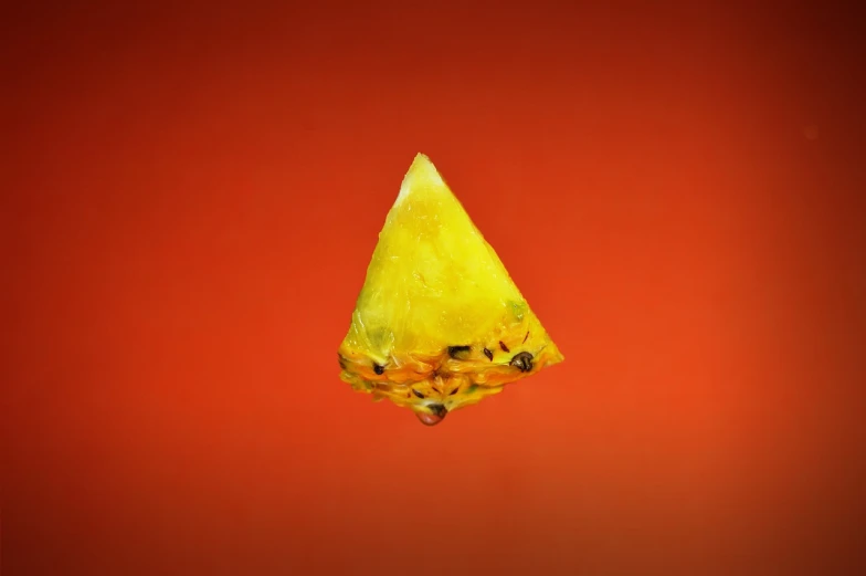 a slice of watermelon on a red background, a macro photograph, by Jan Rustem, crystal cubism, yellow gemstones, tiny firespitter, 2000s photo, melted cheddar